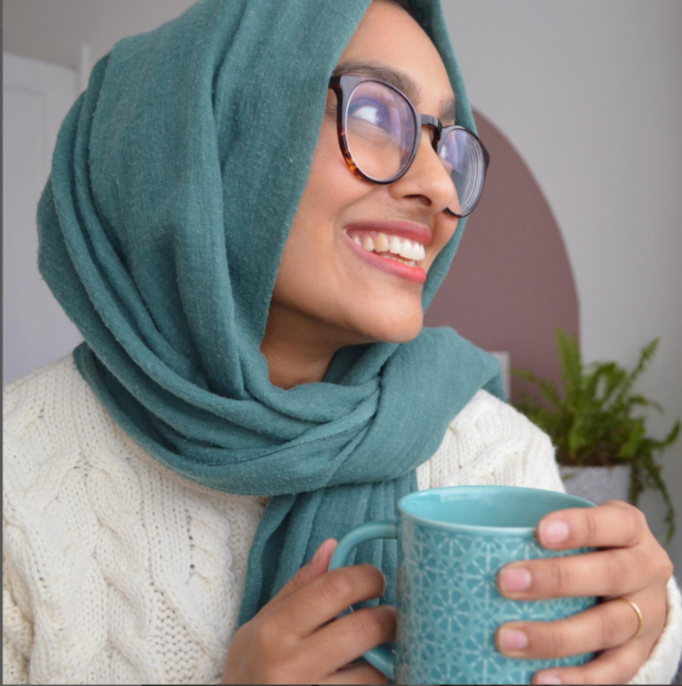 A young woman drinking tea