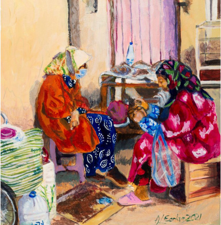 Two ladies drinking tea at an outdoors table