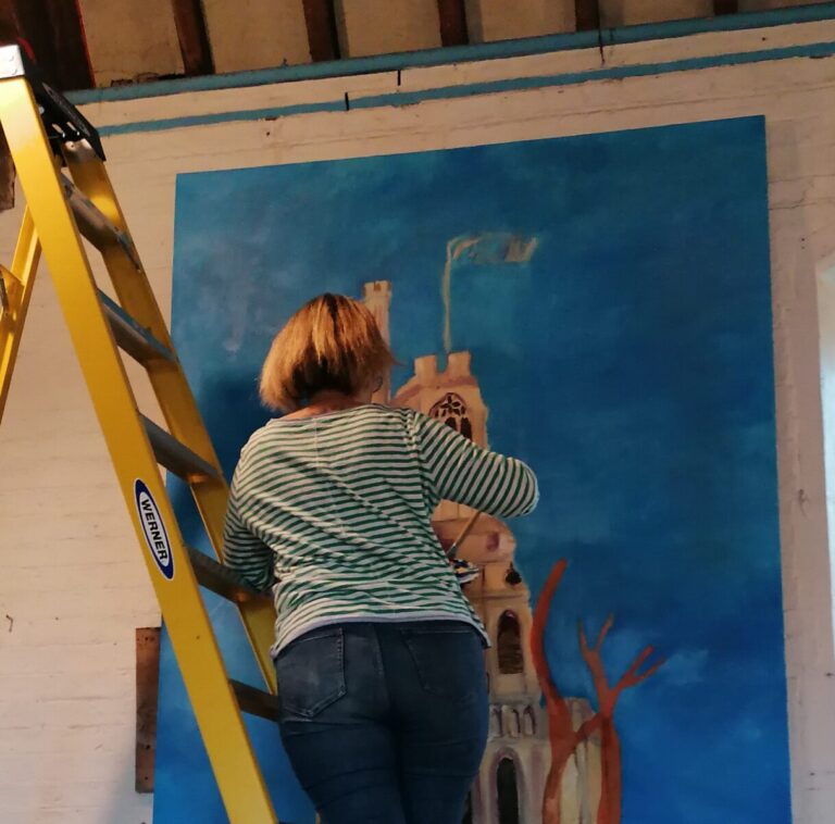 Amanda Earlam painting from a ladder