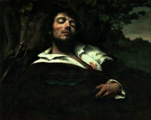 A man asleep out of doors
