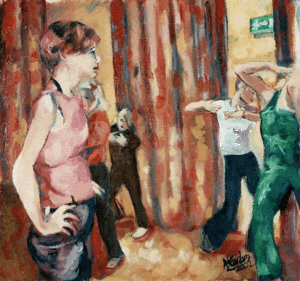 A dancer watches other dancers in class
