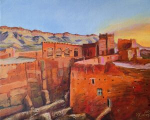 A red-walled kasbah by sunrise