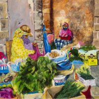 Two ladies selling herbs in a market.